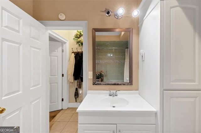 1625 Clark Lake Dr NW, Acworth, GA 30102 - bathroom featuring vanity, tile patterned floors, and a tile shower