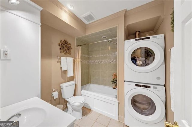 1625 Clark Lake Dr NW, Acworth, GA 30102 - full bathroom with stacked washer and clothes dryer, tile patterned flooring, toilet, shower / bath combo, and ornamental molding