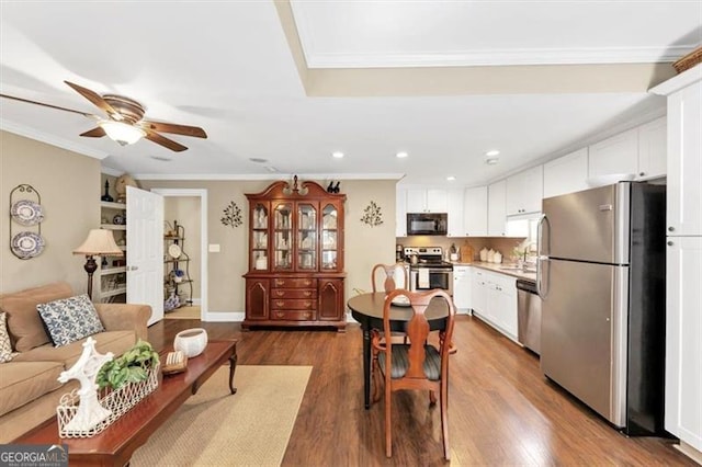 1625 Clark Lake Dr NW, Acworth, GA 30102 - dining space with ornamental molding, a ceiling fan, recessed lighting, and dark wood-style flooring