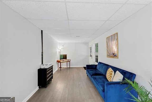 1625 Clark Lake Dr NW, Acworth, GA 30102 - living room featuring wood finished floors, a paneled ceiling, and baseboards