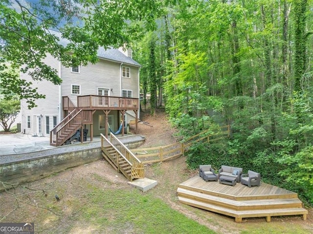1625 Clark Lake Dr NW, Acworth, GA 30102 - rear view of property featuring a wooden deck, stairs, a chimney, and a patio