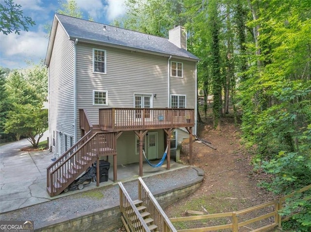 1625 Clark Lake Dr NW, Acworth, GA 30102 - rear view of property featuring stairs, a patio area, and a wooden deck