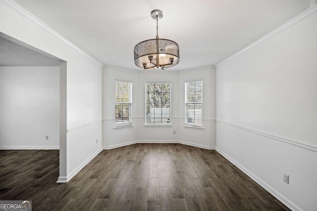 2885 Field Spring Dr, Lithonia, GA 30058 - unfurnished dining area with dark wood-style floors, a chandelier, crown molding, and baseboards