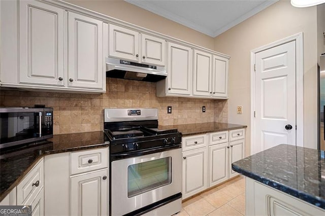 404 Pine Grove Way, Woodstock, GA 30189 - kitchen with appliances with stainless steel finishes, under cabinet range hood, crown molding, decorative backsplash, and dark stone countertops