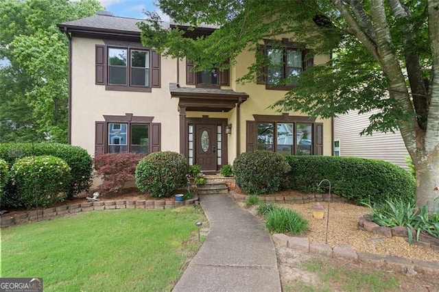 404 Pine Grove Way, Woodstock, GA 30189 - view of front of property featuring stucco siding and a front lawn