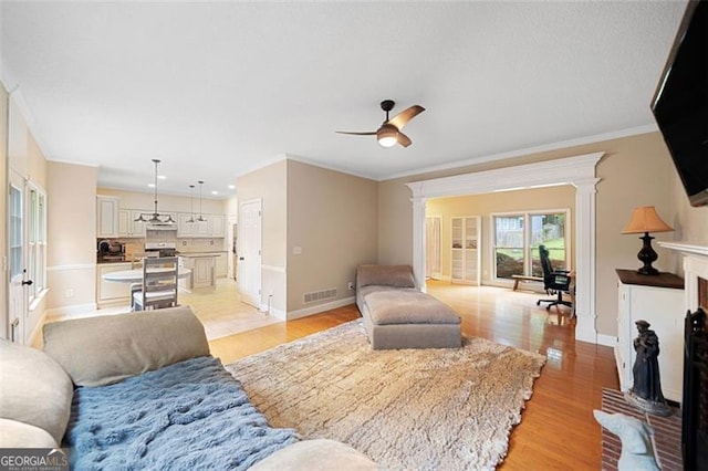 404 Pine Grove Way, Woodstock, GA 30189 - living room featuring ornamental molding, ornate columns, baseboards, light wood-style floors, and recessed lighting