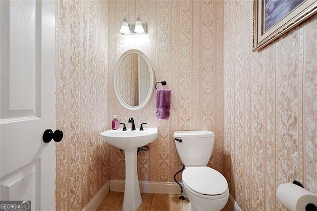 404 Pine Grove Way, Woodstock, GA 30189 - bathroom featuring baseboards, tile patterned floors, toilet, and a sink