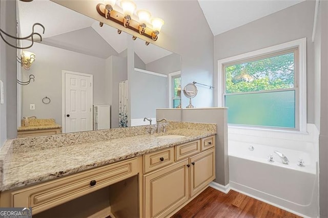 404 Pine Grove Way, Woodstock, GA 30189 - full bathroom with wood finished floors, lofted ceiling, vanity, a bath, and curtained shower