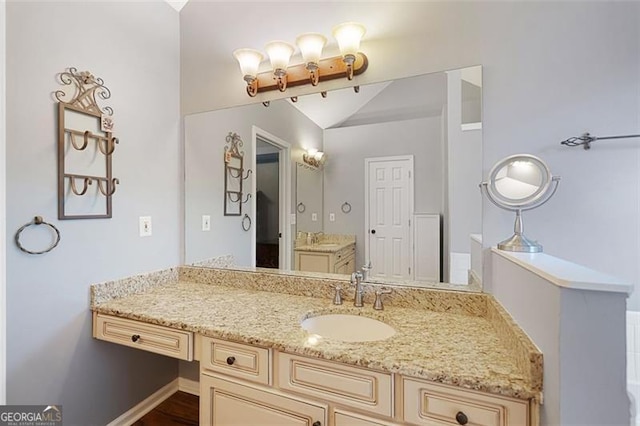 404 Pine Grove Way, Woodstock, GA 30189 - bathroom with vanity and vaulted ceiling