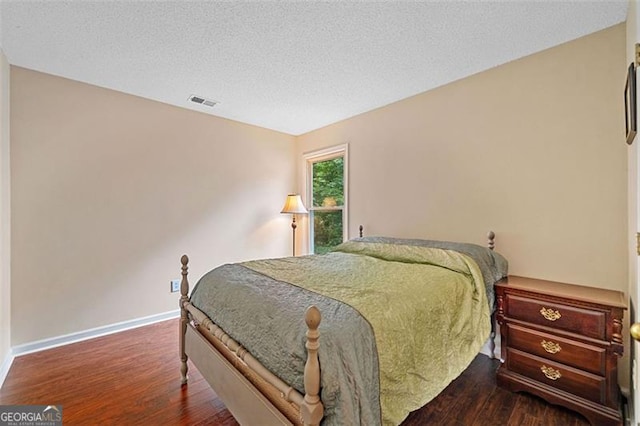 404 Pine Grove Way, Woodstock, GA 30189 - bedroom with wood finished floors, baseboards, and a textured ceiling