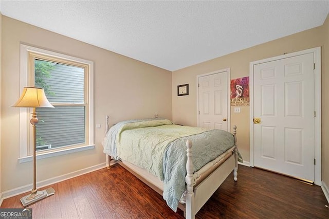 404 Pine Grove Way, Woodstock, GA 30189 - bedroom with baseboards and wood finished floors
