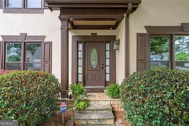 404 Pine Grove Way, Woodstock, GA 30189 - view of exterior entry with stucco siding