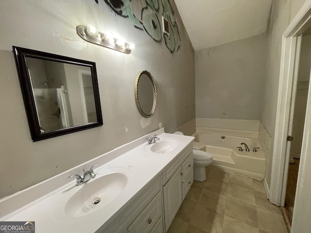 3840 Whitaker Ln, Lithia Springs, GA 30122 - bathroom featuring a garden tub, double vanity, and toilet