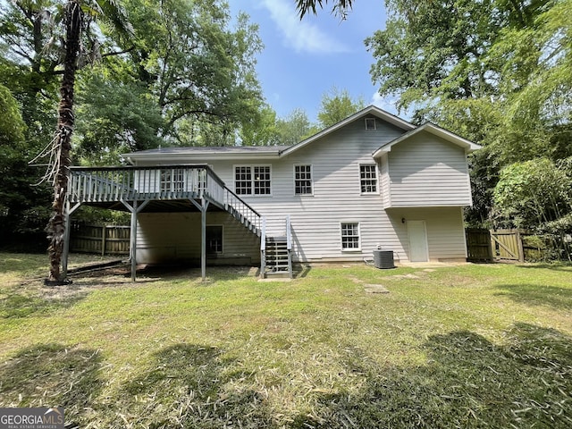 3840 Whitaker Ln, Lithia Springs, GA 30122 - back of property featuring stairway, central AC, a deck, and a gate