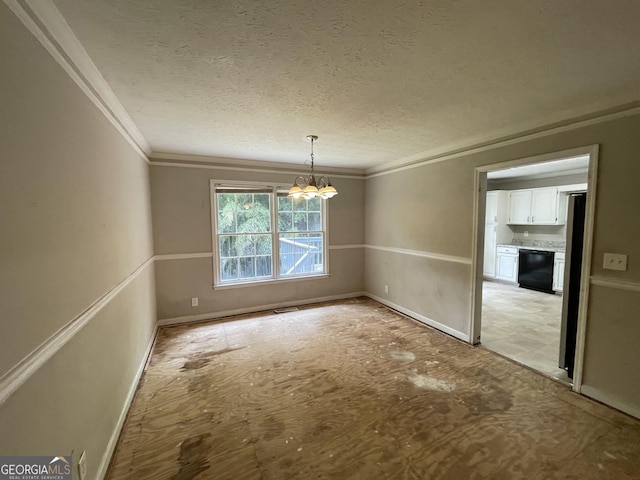 3840 Whitaker Ln, Lithia Springs, GA 30122 - unfurnished dining area with a chandelier, ornamental molding, a textured ceiling, and baseboards