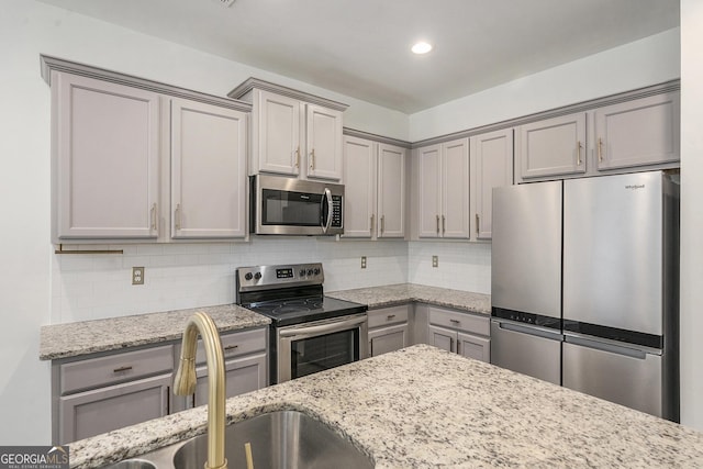 3473 Shoal Oak Ct, Riverdale, GA 30296 - kitchen with appliances with stainless steel finishes, gray cabinetry, backsplash, and recessed lighting