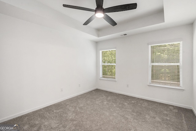 3473 Shoal Oak Ct, Riverdale, GA 30296 - carpeted empty room with a tray ceiling and ceiling fan