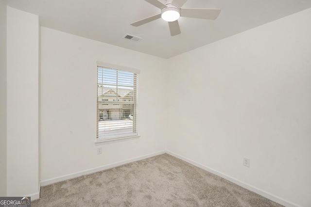 3473 Shoal Oak Ct, Riverdale, GA 30296 - carpeted empty room with baseboards and a ceiling fan