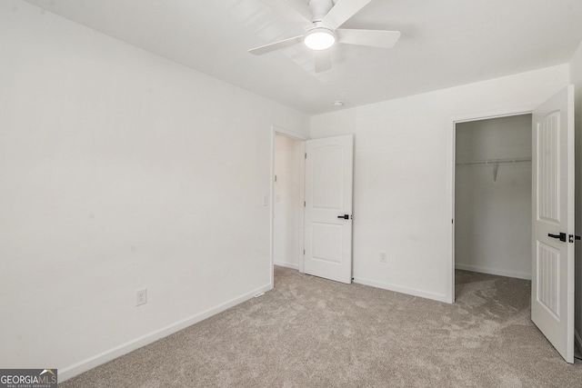 3473 Shoal Oak Ct, Riverdale, GA 30296 - unfurnished bedroom with carpet flooring, a closet, a walk in closet, and a ceiling fan