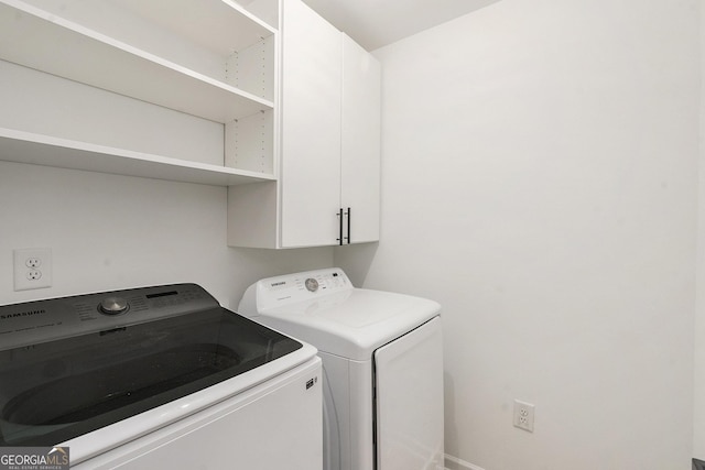 3473 Shoal Oak Ct, Riverdale, GA 30296 - laundry room featuring washing machine and dryer and cabinet space