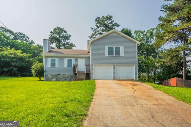 4331 Wrexham Ct, Snellville, GA 30039 - split level home with a garage, a chimney, and driveway