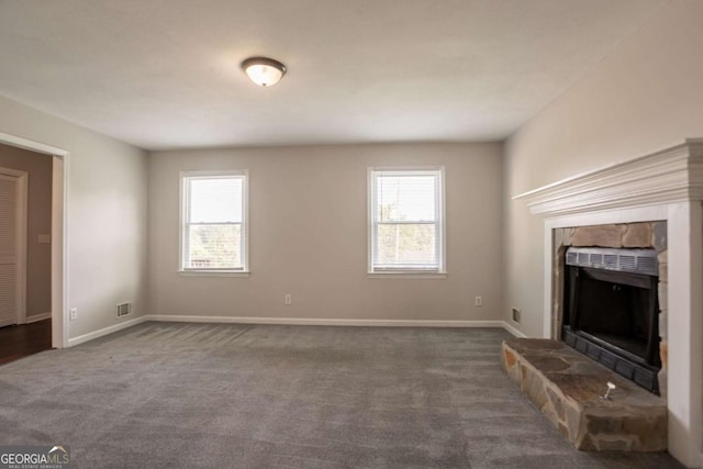 4331 Wrexham Ct, Snellville, GA 30039 - unfurnished living room featuring plenty of natural light, a stone fireplace, carpet floors, and baseboards