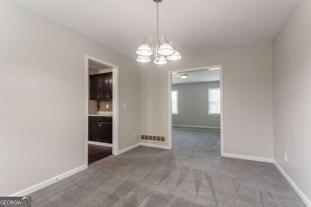 4331 Wrexham Ct, Snellville, GA 30039 - empty room featuring carpet floors, a chandelier, and baseboards