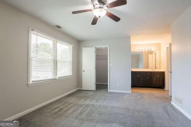 4331 Wrexham Ct, Snellville, GA 30039 - unfurnished bedroom with light colored carpet, baseboards, a spacious closet, and ensuite bathroom