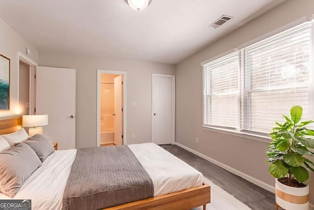 4331 Wrexham Ct, Snellville, GA 30039 - bedroom with baseboards and connected bathroom