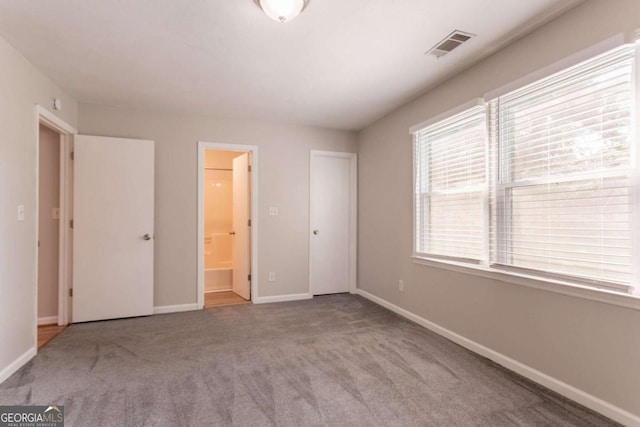 4331 Wrexham Ct, Snellville, GA 30039 - unfurnished bedroom with carpet flooring, baseboards, and ensuite bath