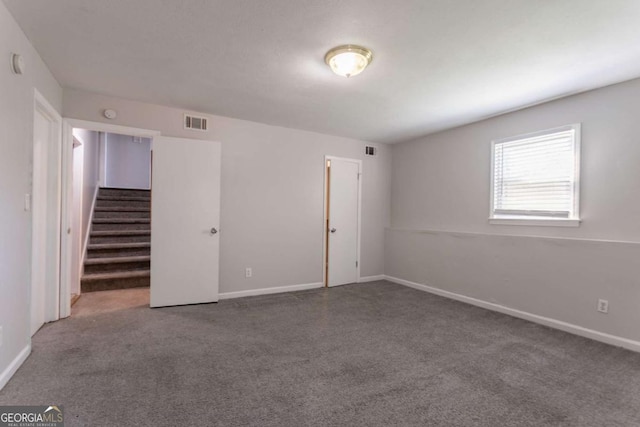 4331 Wrexham Ct, Snellville, GA 30039 - carpeted empty room with stairway and baseboards