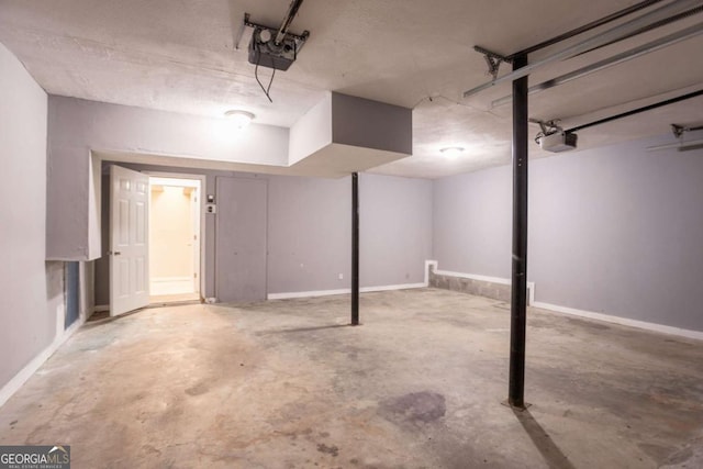 4331 Wrexham Ct, Snellville, GA 30039 - garage with a garage door opener and baseboards