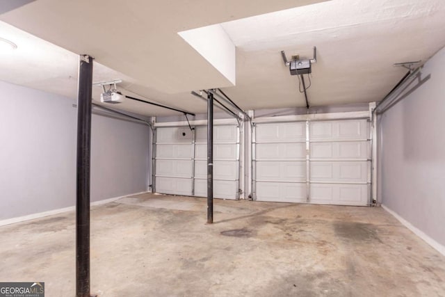 4331 Wrexham Ct, Snellville, GA 30039 - garage with a garage door opener and baseboards