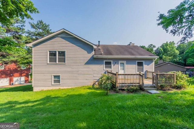 4331 Wrexham Ct, Snellville, GA 30039 - rear view of house featuring a wooden deck, a chimney, a lawn, and a shingled roof