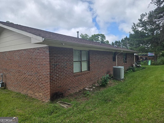 1453 Rose Ln, Toccoa, GA 30577 - view of property exterior featuring cooling unit, brick siding, and a lawn