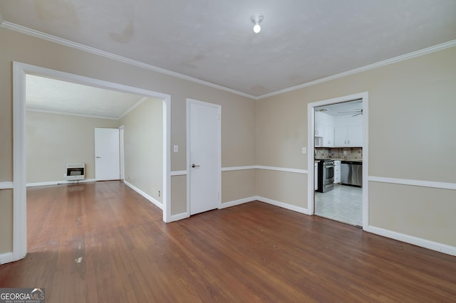 3080 Lynhurst Cir SW, Atlanta, GA 30311 - empty room featuring heating unit, wood finished floors, and ornamental molding