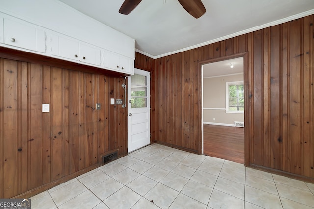 3080 Lynhurst Cir SW, Atlanta, GA 30311 - foyer entrance with a ceiling fan, ornamental molding, wood walls, and light tile patterned flooring