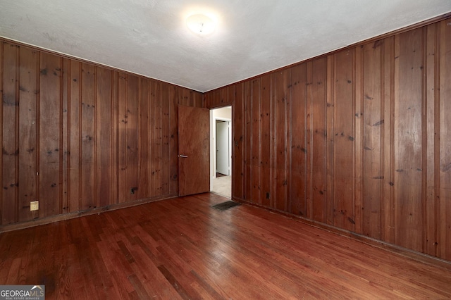 3080 Lynhurst Cir SW, Atlanta, GA 30311 - empty room with wood finished floors and wood walls