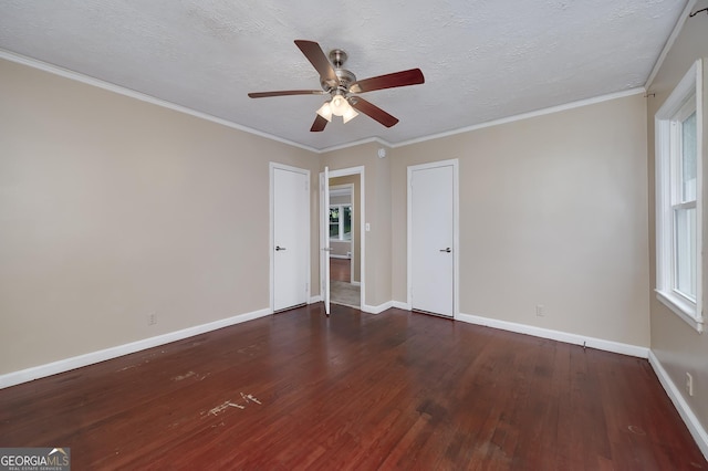 3080 Lynhurst Cir SW, Atlanta, GA 30311 - unfurnished room with dark wood-type flooring, a ceiling fan, a textured ceiling, and ornamental molding