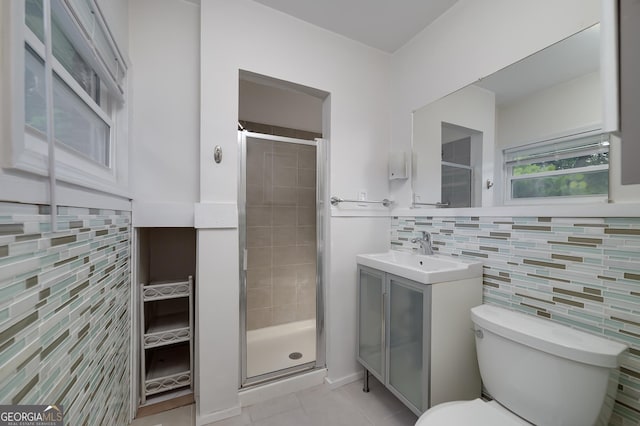 3080 Lynhurst Cir SW, Atlanta, GA 30311 - bathroom featuring tile walls, a stall shower, vanity, tile patterned flooring, and backsplash