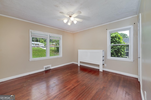3080 Lynhurst Cir SW, Atlanta, GA 30311 - spare room with hardwood / wood-style flooring, plenty of natural light, ceiling fan, a textured ceiling, and ornamental molding