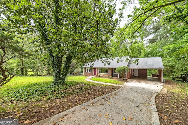 3080 Lynhurst Cir SW, Atlanta, GA 30311 - ranch-style home with asphalt driveway, an attached carport, and brick siding