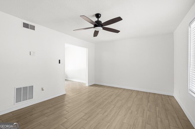 169 Peyton Pl SW, Atlanta, GA 30311 - unfurnished room featuring wood finished floors, a ceiling fan, baseboards, and a textured ceiling