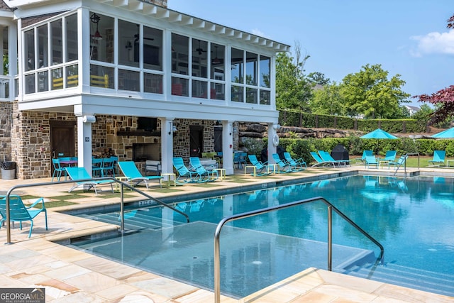 8218 Lallarook Dr, Columbus, GA 31909 - community pool featuring a sunroom, a patio area, and a ceiling fan