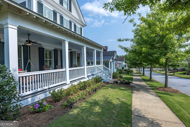 8218 Lallarook Dr, Columbus, GA 31909 - view of property exterior with covered porch, a ceiling fan, and a lawn