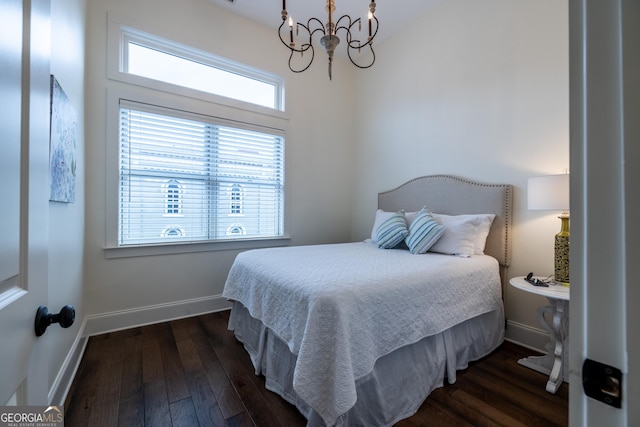 1 E 3rd Ave Unit 308, Rome, GA 30161 - bedroom with a chandelier, baseboards, and dark wood-type flooring