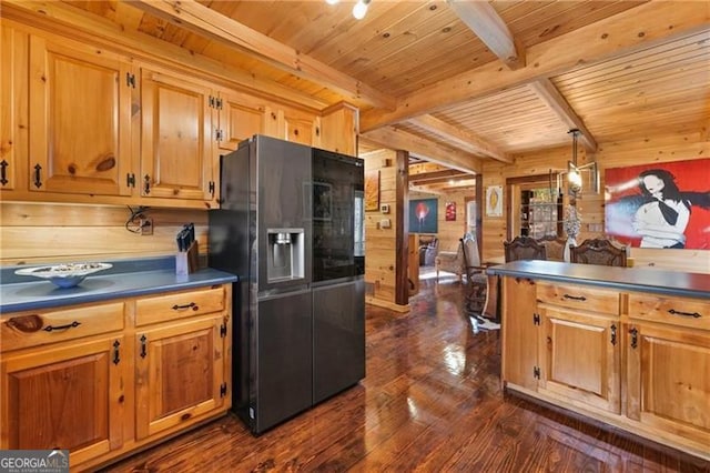281 Wildwood Ct, Dawsonville, GA 30534 - kitchen featuring refrigerator with ice dispenser, wood walls, wooden ceiling with exposed beams, dark countertops, and dark wood-type flooring