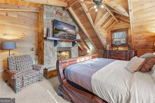 281 Wildwood Ct, Dawsonville, GA 30534 - carpeted bedroom with wood walls, a stone fireplace, and wooden ceiling