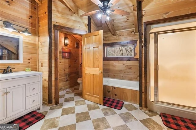 281 Wildwood Ct, Dawsonville, GA 30534 - full bathroom with wood walls, vanity, a garden tub, a ceiling fan, and toilet