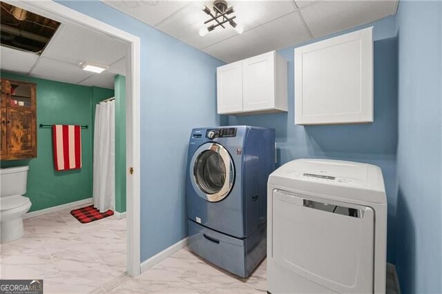 281 Wildwood Ct, Dawsonville, GA 30534 - laundry room with washing machine and dryer, light marble finish flooring, and baseboards